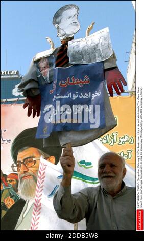 NO FILM, NO VIDEO, NO TV, NO DOCUMENTARY - © KRT/ABACA. 55875-3. Tehran-Iran, February 9, 2004. An old man holds a placard which reads The Great Satan cannot harm Iran during a demonstration to mark the anniversary of hostage taking at the U.S. embassy in Tehran. Stock Photo