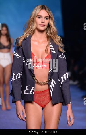 A model walks the runway during the Etam Fashion Show as part of