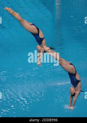 NO FILM, NO VIDEO, NO TV, NO DOCUMENTARY - China's Jingjing Guo and Minxia Wu dive their way to gold in the 3-meter synchronized diving competition in the 2004 Olympic Games in Athens, Greece, on Saturday, August 14, 2004. Photo by Joe Rossi/KRT/ABACA Stock Photo