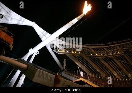 NO FILM, NO VIDEO, NO TV, NO DOCUMENTARY - The ceremonial Olympic torch is raised over the Olympic Stadium during the opening ceremonies for the 2004 Olympic Games on Friday, August 13, 2004, in Athens, Greece.Photo by Nhat V. Meyer/San Jose Mercury News/KRT/ABACA. Stock Photo