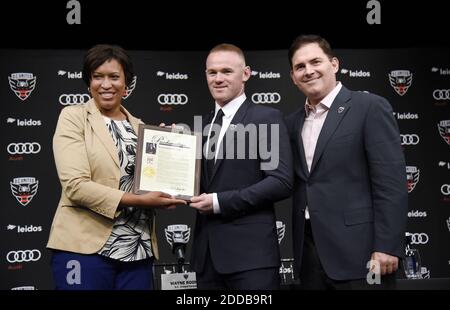 English international soccer player Wayne Rooney flanked by Mayor of Washington, D.C. Muriel Bowser (L) and Jason Levien , United Managing Partner and CEO receives the 'Wayne Rooney Day' proclamation during the media unveiling at the Newseum on July 2, 2018 in Washington, DC, USA. Photo by Olivier Douliery/ Abaca Press