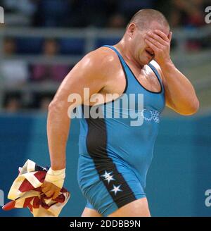 NO FILM, NO VIDEO, NO TV, NO DOCUMENTARY - Rulon Gardner of the United States is emotional after winning the bronze medal in the 120kg greco-roman weight class at the 2004 Olympic Games on Wednesday, August 25, 2004. Gardner then left his shoes on the mat to symbolize his retirement from wrestling Stock Photo