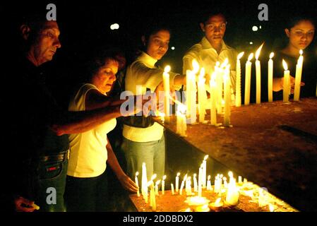 NO FILM, NO VIDEO, NO TV, NO DOCUMENTARY - In Colombo, Sri Lanka, candles are lighted at Vihara Maha Devi Park in memorial for the tsunami victims, Friday, December 31, 2004. New Year's Eve celebration are cancelled as the death toll is expected to surpass 29,000. Sunday's 9.0 magnitude quake struck just off the coast of Sumatra, near the Indian archipelago, sending walls of water racing across the Indian Ocean and wiping out coasts in 11 nations. After Indonesia, Sri Lanka was the next hardest hit, with about 28,500 deaths. A total of more than 300 were killed in Malaysia, Myanmar, Bangladesh Stock Photo