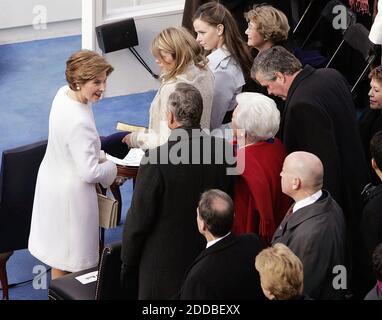 NO FILM, NO VIDEO, NO TV, NO DOCUMENTARY - First Lady Laura Bush chats with former President George H.W. Bush and Barbara Bush, on the inaugural stage January 20, 2005 in Washington, D.C., where U.S. President George W. Bush will be sworn in for a second term during the inaugural ceremony. Washington, DC, USA, on January 20, 2005. Photo by Chuck Kennedy/US News Story Slugged/KRT/ABACA. Stock Photo