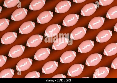 Pattern of rugby balls against red background Stock Photo