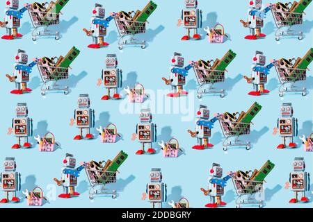 Pattern of vintage robot toys standing by miniature shopping carts and baskets filled with electronic equipment Stock Photo