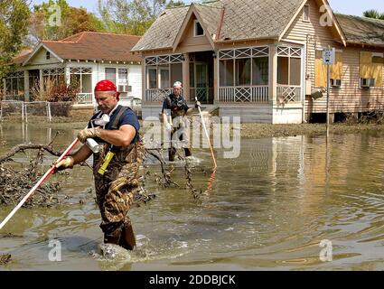 NO FILM, NO VIDEO, NO TV, NO DOCUMENTARY - Firefighters conduct a search of a New Orleans, Louisiana, neighborhood still flooded by Hurricane Katrina on Wednesday, September 14, 2005. Some parts of the city, including the French Quarter may be open as early as Monday. Photo by Khampha Bouaphanh/fort Worth Star Taelegram/KRT/ABACAPRESS.COM Stock Photo