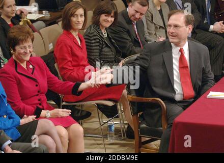 NO FILM, NO VIDEO, NO TV, NO DOCUMENTARY - Samuel Alito, President George W. Bush's nominee for Associate Justice of the Supreme Court, holds hands with his wife, Martha, as he introduces his family to the Senate Judiciary Committee for his confirmation hearing on Monday, January 9, 2006, in Washington, DC. Photo by George Bridges/KRT/ABACAPRESS.COM Stock Photo