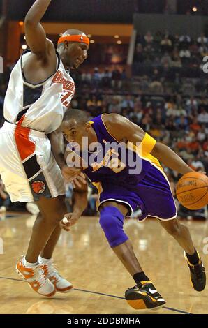 NO FILM, NO VIDEO, NO TV, NO DOCUMENTARY - Los Angeles Lakers guard Kobe Bryant lowers his shoulder and tries to drive past Jumaine Jones of the Charlotte Bobcats during first half action. The Bobcats defeated the Lakers, 112-102, at the Charlotte Bobcats Arena in Charlotte, NC, USA on February 3, 2006. Photo by Jeff Siner/Charlotte Observer/KRT/Cameleon/ABACAPRESS.COM. Stock Photo
