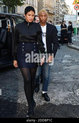 Helen Lasichanh, from left, Rocket Ayer Williams and Pharrell Williams  arrive for the Off-White Ready To Wear Fall/Winter 2022-2023 fashion  collection, unveiled during the Fashion Week in Paris, Monday, Feb. 28,  2022. (