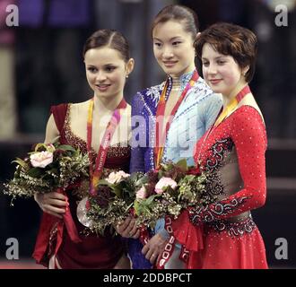 NO FILM, NO VIDEO, NO TV, NO DOCUMENTARY - Figure skating medalists (from left to right) Sasha Cohen, of the USA (silver, Shizuka Arakaw, of Japan (gold) and Irina Slutskaya, of Russia (bronze) stand together on the medals stand following the ladies' free skating program during the 2006 Winter Olympics held at Palavela in Turin, Italy on February 23, 2006. Photo by Barbara L. Johnston/Philadelphia Inquirer/KRT/Cameleon/ABACAPRESS.COM Stock Photo