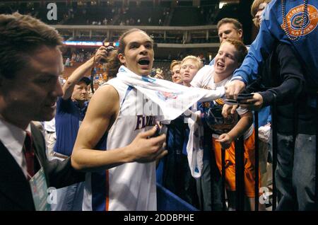 NO FILM, NO VIDEO, NO TV, NO DOCUMENTARY - Florida's Joakim Noah celebrates with fans as he heads into the tunnel following their 76-50 victory over South Alabama, Thursday, March 16, 2006, in the first round of the NCAA tournament at the Veterans Memorial Arena in Jacksonville, Florida. Photo by Gary W. Green/Orlando Sentinel/KRT/ABACAPRESS.COM Stock Photo