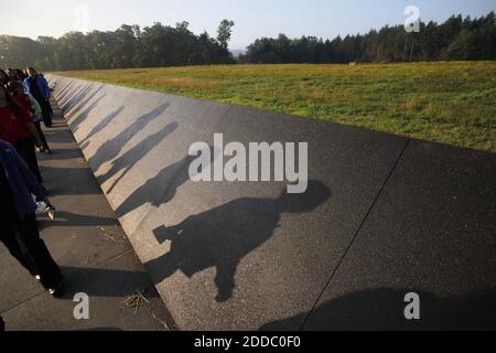 NO FILM, NO VIDEO, NO TV, NO DOCUMENTARY - Visitors cast long shadows on the wall bordering the sacred ground crash site at the new FL93 memorial on Sunday, September 11, 2011 in Shanksville, Pennsylvania. Photo by Laurence Kesterson/Philadelphia Inquirer/MCT/ABACAPRESS.COM Stock Photo