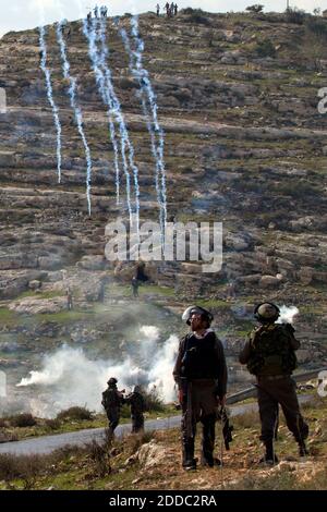 NO FILM, NO VIDEO, NO TV, NO DOCUMENTARY - Israeli soldiers fire tear gas at Palestinian protesters in Nebi Selah, Israel on December 16, 2011. Photo by Maya Levin/MCT/ABACAPRESS.COM Stock Photo