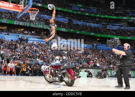 NO FILM, NO VIDEO, NO TV, NO DOCUMENTARY - The Minnesota Timberwolves' Derrick Williams dunks over a motorcycle in the Slam Dunk Contest during NBA All-Star festivities at the Amway Center in Orlando, FL, USA on February 25, 2012. Photo by Gary W. Green/Orlando Sentinel/MCT/ABACAPRESS.COM Stock Photo