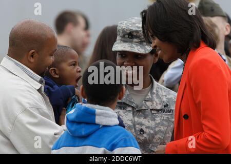 NO FILM, NO VIDEO, NO TV, NO DOCUMENTARY - First lady Michelle Obama makes funny faces with two-year-old Izaiah Garner as she arrives at Raleigh-Durham International Airport on Friday, March 2, 2012. A number of active duty and veteran service members, from all the military branches, and their families were on hand to welcome her to North Carolina. Izaiah's mom Stacy Garner, center, is a staff sergeant with the National Guard. He's being held by his father Darryl Garner, with his brother Tyler looking on. Photo by Shawn Rocco/Raleigh News & Observer/MCT/ABACAPRESS.COM Stock Photo