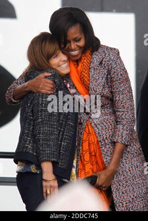 NO FILM, NO VIDEO, NO TV, NO DOCUMENTARY - First lady Michelle Obama gives Melinda Cook, a descendant of Dorothy Stratton, a hug during a ceremony for the Coast Guard Cutter Stratton on Coast Guard Island in Alameda, CA, USA ON March 31, 2012. The first lady made the trip to California to join in the commissioning ceremony placing the ship into active service. Mrs. Obama, a sponsor of the Cutter Stratton, helped christen the ship in Pascagoula, Mississippi, in 2010 by breaking a champagne bottle over the bow. Photo by Anda Chu/Oakland Tribune/MCT/ABACAPRESS.COM Stock Photo