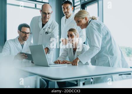 Team of doctors and scientist using laptop while working at office Stock Photo