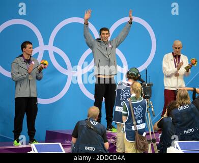 NO FILM, NO VIDEO, NO TV, NO DOCUMENTARY - USA swimmer Michael Phelps waves to the crowd as he prepares to receive his gold medal for the men's 200m individual medley at the Aquatics Center during the 2012 Summer Olympic Games in London, UK, Thursday, August 2, 2012. Phelps won the gold, the USA's Ryan Lochte, left, the silver medal, and Hungary's Laszlo Cseh, right, the bronze medal. Photo by Chuck Myers/MCT/ABACAPRESS.COM Stock Photo