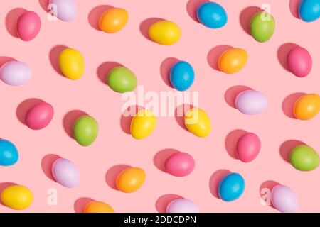 Multi colored easter eggs on pink background Stock Photo