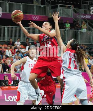 NO FILM, NO VIDEO, NO TV, NO DOCUMENTARY - USA's Diana Taurasi (12) scores over China's Ma Zengyu (11) during their game at the Basketball Arena at the Olympic Park during the 2012 Summer Olympic Games in London, UK, Sunday, August 5, 2012. Photo by Harry E. Walker/MCT/ABACAPRESS.COM Stock Photo