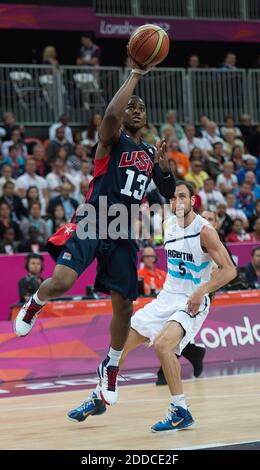 USA s Chris Paul 13 scores on a fast break in front of Argentina s Manu Ginobili 5 during their game at the Olympic Park Basketball Arena during the 2012 Summer Olympic Games in