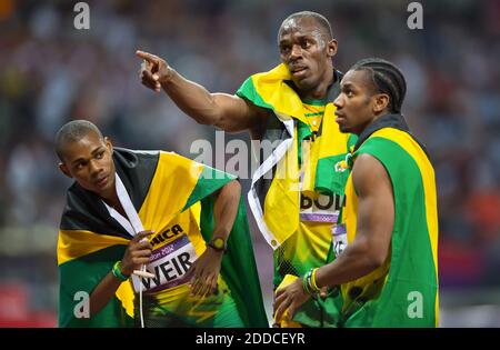 NO FILM, NO VIDEO, NO TV, NO DOCUMENTARY - Gold medalist Usain Bolt of Jamaica, center, celebrated with his teammates and bronze medalist Warren Weir, left, and silver medalist Yohan Blake, right, in the men's 200m final in a time of 19.32 at Olympic Stadium during the 2012 Summer Olympic Games in London, UK on August 9, 2012. Photo by David Eulitt/Kansas City Star/MCT/ABACAPRESS.COM Stock Photo