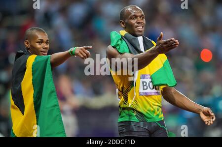 NO FILM, NO VIDEO, NO TV, NO DOCUMENTARY - Gold medalist Usain Bolt of Jamaica, center, celebrated with his teammate and bronze medalist Warren Weir, left, in the men's 200m final in a time of 19.32 at Olympic Stadium during the 2012 Summer Olympic Games in London, UK on August 9, 2012. Photo by David Eulitt/Kansas City Star/MCT/ABACAPRESS.COM Stock Photo