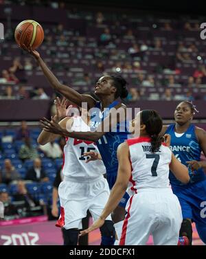 NO FILM, NO VIDEO, NO TV, NO DOCUMENTARY - France's Emilie Gomis (11) drives to the basket between USA's Candace Parker (15) and Maya Moore (7) during their Gold Medal Basketball game at the North Greenwich Arena during the 2012 Summer Olympic Games in London, UK on August 11, 2012. USA defeated France 86-50 to win the Gold Medal. Photo by Harry E. Walker/MCT/ABACAPRESS.COM Stock Photo