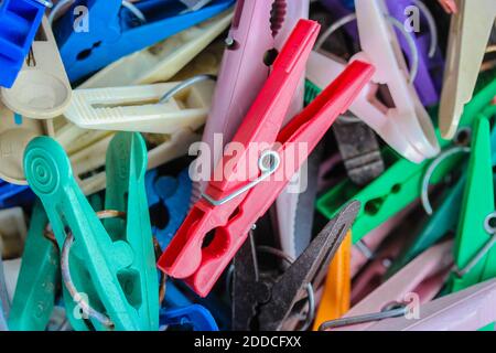 Many colorful bright close-up clothespins Stock Photo