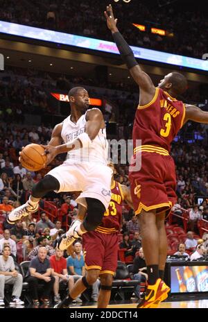 NO FILM, NO VIDEO, NO TV, NO DOCUMENTARY - The Miami Heat's Dwyane Wade, left, tries to pass the ball against the Cleveland Cavaliers' Dion Waiters (3) in the second half at AmericanAirlines Arena in Miami, FL, USA on November 24, 2012. Photo by Hector Gabino/El Nuevo Herald/MCT/ABACAPRESS.COM Stock Photo