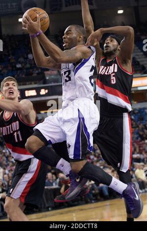 NO FILM, NO VIDEO, NO TV, NO DOCUMENTARY - Sacramento Kings shooting guard Marcus Thornton (23) drives to the basket past Portland Trail Blazers center Meyers Leonard (11) and shooting guard Will Barton (5) during an NBA game at Sleep Train Arena in Sacramento, CA, USA on December 23, 2012. Photo by Randall Benton/Sacramento Bee/MCT/ABACAPRESS.COM Stock Photo