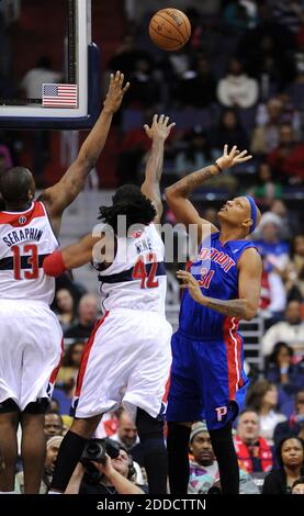NO FILM, NO VIDEO, NO TV, NO DOCUMENTARY - Detroit Pistons power forward Charlie Villanueva (31) lofts up a score over Washington Wizards power forward Kevin Seraphin (13) and Wizards center Nene (42) in the fourth quarter at the Verizon Center in Washington, DC, USA on December 22, 2012. The Pistons defeated the Wizards, 96-87.Photo by Chuck Myers/MCT/ABACAPRESS.COM Stock Photo