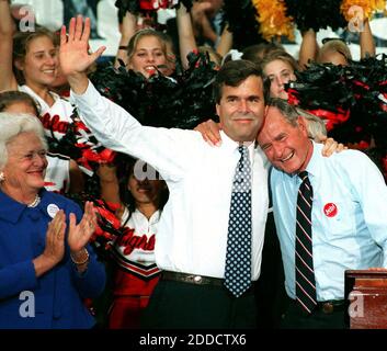 NO FILM, NO VIDEO, NO TV, NO DOCUMENTARY - File photo : Former U.S. president George Bush embraces his son, Jeb, as Barbara Bush applauds during a rally in downtown Orlando, Florida, October 10, 1994. Appearing before a raucous rally in front of thousands of supporters in Miami on Monday June 15, 2015, former Florida governor Jeb Bush officially launched his presidential election campaign. Photo by Joe Burbank/Orlando Sentinel/MCT/ABACAPRESS.COM Stock Photo