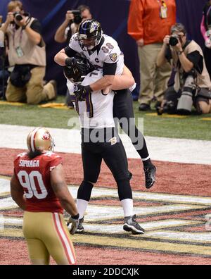 Baltimore Ravens center Matt Birk (77) walks on the sidelines