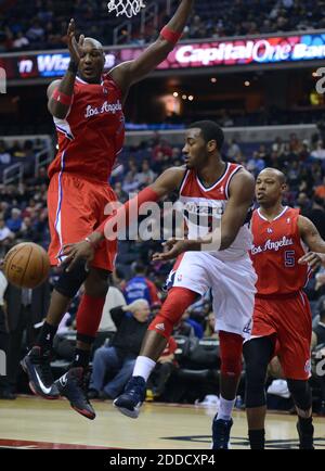 NO FILM, NO VIDEO, NO TV, NO DOCUMENTARY - Washington Wizards point guard John Wall (2) dishes the ball off around Los Angeles Clippers power forward Lamar Odom (7) in the third quarter at the Verizon Center in Washington, DC, USA on February 4, 2013. The Wizards defeated the Clippers, 98-90. Photo by Chuck Myers/MCT/ABACAPRESS.COM Stock Photo