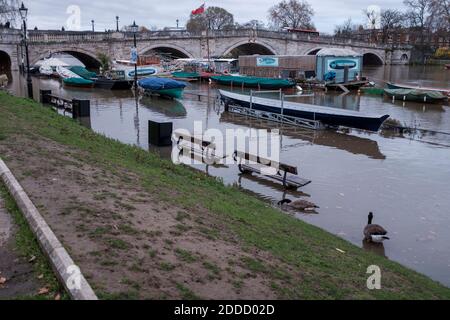 River Thames at high tide , flooded Richmond Riverside,Richmond Upon Thames,Surrey,UK Stock Photo