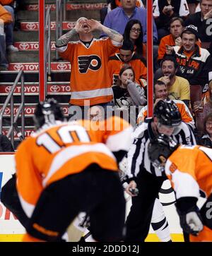 NO FILM, NO VIDEO, NO TV, NO DOCUMENTARY - A Philadelphia Flyers fan cheers on the Flyers during the third period against the Pittsburgh Penguins at the Wells Fargo Center in Philadelphia, PA, USA on March 7, 2013. Pittsburgh won, 5-4. Photo by Yong Kim/Philadelphia Daily News/MCT/ABACAPRESS.COM Stock Photo
