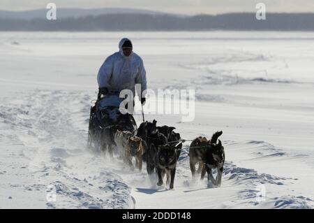 https://l450v.alamy.com/450v/2ddd148/no-film-no-video-no-tv-no-documentary-four-time-iditarod-champion-martin-buser-drives-his-dog-team-up-the-wind-swept-yukon-river-as-he-nears-kaltag-alaska-usa-on-saturday-march-9-2013-photo-by-bill-rothanchorage-daily-newsmctabacapresscom-2ddd148.jpg