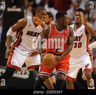 Chicago Bulls guard Nate Robinson (2) drives past Brooklyn Nets guard C ...