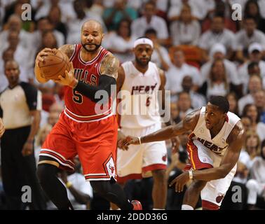 NO FILM, NO VIDEO, NO TV, NO DOCUMENTARY - Chicago Bulls' Carlos Boozer grabs a rebound in front of Miami Heat guard Mario Chalmers during the first quarter of the NBA Eastern Conference playoffs at the AmericanAirlines Arena in Miami, Florida, USA on Wednesday, May 6, 2013. Photo by Joe Cavaretta/Sun Sentinel/MCT/ABACAPRESS.COM Stock Photo