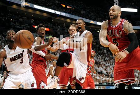 NO FILM, NO VIDEO, NO TV, NO DOCUMENTARY - Miami Heat forward Chris Bosh is fouled by Chicago Bulls forward Carlos Boozer during the second quarter in Game 5 of the NBA Eastern Conference playoffs at the AmericanAirlines Arena in Miami, FL, USA on May 15, 2013. Photo by Michael Laughlin/Sun Sentinel/MCT/ABACAPRESS.COM Stock Photo