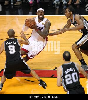 NO FILM, NO VIDEO, NO TV, NO DOCUMENTARY - The Miami Heat's LeBron James drives against the San Antonio Spurs' Tony Parker (9), Manu Ginobili (20), and Kawhi Leonard in the first quarter in Game 6 of the NBA Finals on at the AmericanAirlines Arena in Miami, FL, USA on June 18, 2013. Photo by David Santiago/El Nuevo Herald/MCT/ABACAPRESS.COM Stock Photo