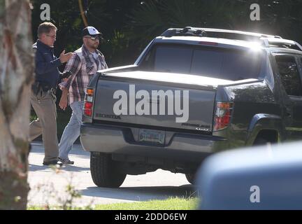 NO FILM, NO VIDEO, NO TV, NO DOCUMENTARY - George Zimmerman, the former Neighborhood Watch volunteer acquitted of murder in the shooting of 17-year-old Trayvon Martin, walks toward his vehicle in Lake Mary, Florida, USA, on Monday, September 9, 2013. Police are investigating a 'possible domestic battery' involving Zimmerman, Lake Mary police officer Zach Hudson said Monday afternoon. The police spokesman said it was his understanding that a gun was involved. Photo by Red Huber/Orlando Sentinel/MCT/ABACAPRESS.COM Stock Photo