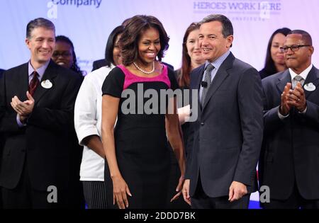 NO FILM, NO VIDEO, NO TV, NO DOCUMENTARY - First lady Michelle Obama is welcomed to the stage by Disney Co. CEO Bob Iger, center right, during Disney's Veterans Institute luncheon, at the Boardwalk Inn at Walt Disney World in Lake Buena Vista, FL, USA, Thursday, November 14, 2013. Photo by Joe Burbank/Orlando Sentinel/MCT/ABACAPRESS.COM Stock Photo