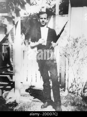 NO FILM, NO VIDEO, NO TV, NO DOCUMENTARY - A worker at the Book Depository, Lee Harvey Oswald, 24, disappears from the building immediately after the shooting, and boards a bus. When the bus gets caught in traffic, he exits, and begins to walk. Oswald soon emerges as a suspect. This photograph of Oswald holding a rifle in the backyard at 214 Neeley St. in Dallas, was among the evidence gathered by the police following the assassination. Photo by Dallas Police Department via Dallas Morning News/MCT/ABACAPRESS.COM Stock Photo