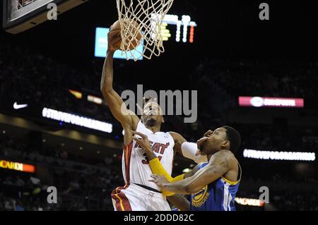 NO FILM, NO VIDEO, NO TV, NO DOCUMENTARY - Miami Heat guard Ray Allen dunks the ball over Golden State Warriors guard Kent Bazemore during the first half at AmericanAirlines Arena in Miami, FL, USA on January 2, 2014. Photo by Michael Laughlin/Sun Sentinel/MCT/ABACAPRESS.COM Stock Photo