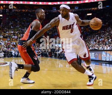 NO FILM, NO VIDEO, NO TV, NO DOCUMENTARY - Miami Heat's LeBron James drives past Toronto Raptors' Terrence Ross during the first quarter at the AmericanAirlines Arena in Miami, FL, USA on January 5, 2014. Photo by Jim Rassol/Sun Sentinel/MCT/ABACAPRESS.COM Stock Photo