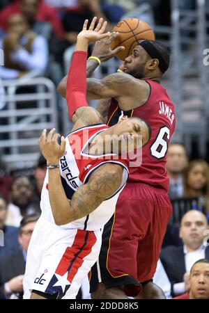 NO FILM, NO VIDEO, NO TV, NO DOCUMENTARY - Washington Wizards shooting guard Bradley Beal 3 falls away after fouling Miami Heat small forward LeBron James 6 during the second half of their game played at the Verizon Center in Washington, DC, USA on January 15, 2014. Washington defeated Miami 114-97. Photo by Harry E. Walker/MCT/ABACAPRESS.COM Stock Photo