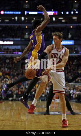 NO FILM, NO VIDEO, NO TV, NO DOCUMENTARY - Chicago Bulls' Mike Dunleavy passes against the defense of Los Angeles Lakers' Nick Young during the 2nd quarter at the United Center in Chicago, IL, USA on January 20, 2014. Photo by Scott Strazzante/Chicago Tribune/MCT/ABACAPRESS.COM Stock Photo